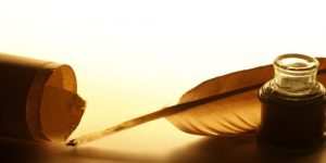 Images of feather quill, ink and parchment